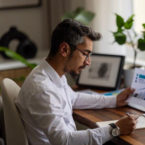 Businessman working on Financial Report of corporate operations, balance